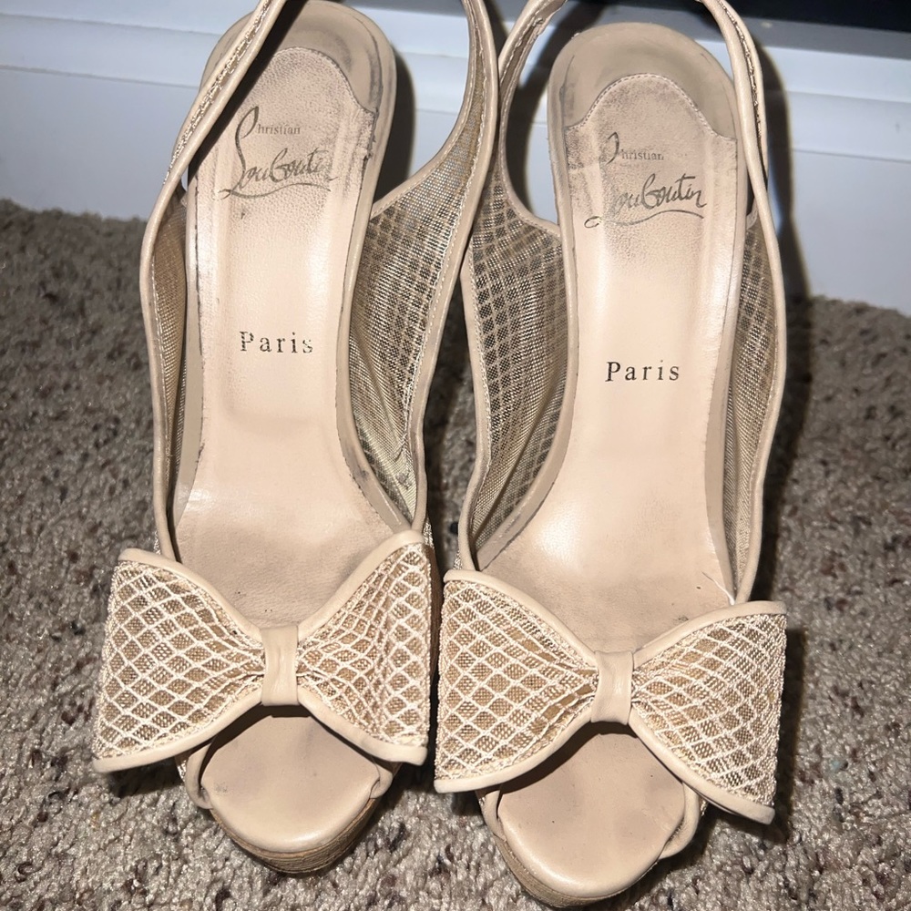 Tan Christian Louboutin heels with bow in front